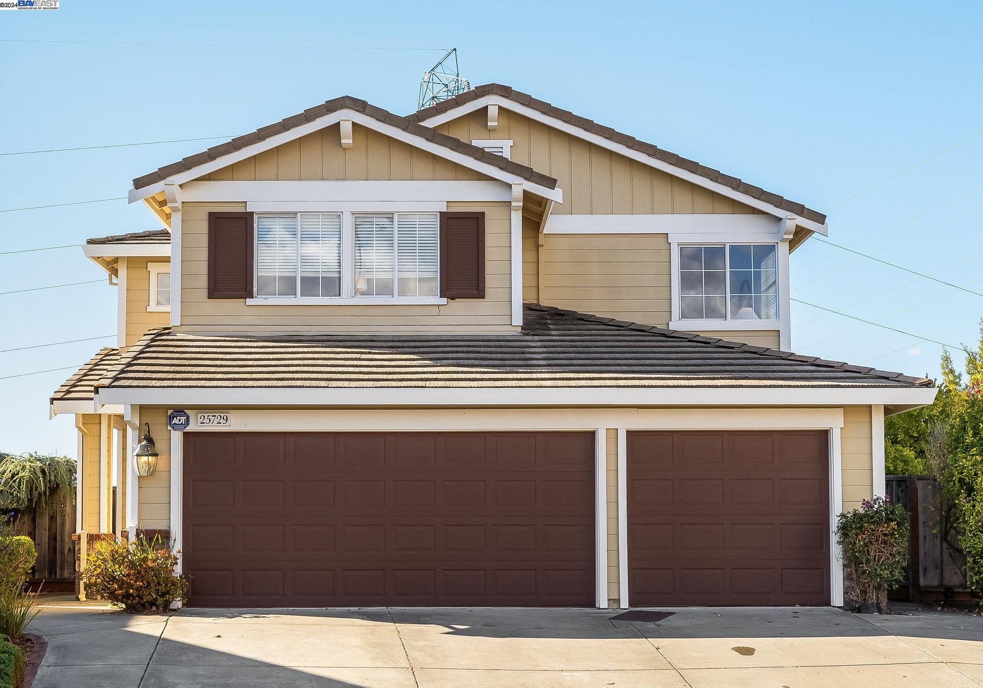 a front view of a house with garage