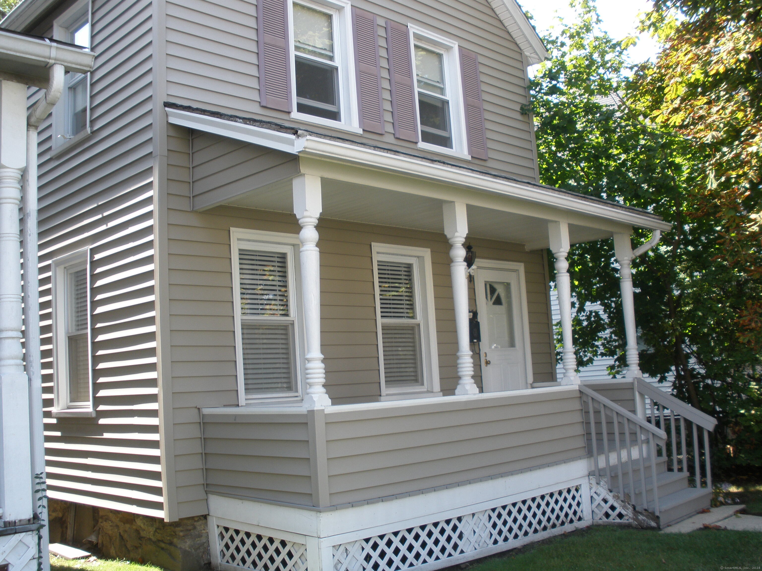 a view of a house with a porch