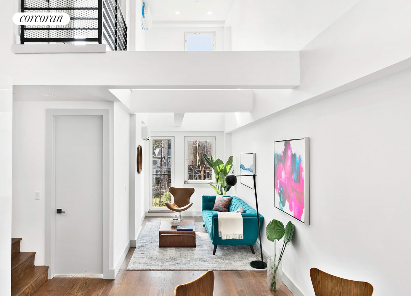 a hallway with a dining table and chairs