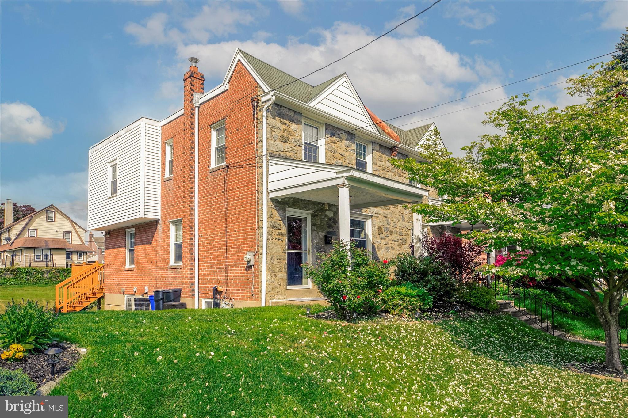 front view of a house with a small yard