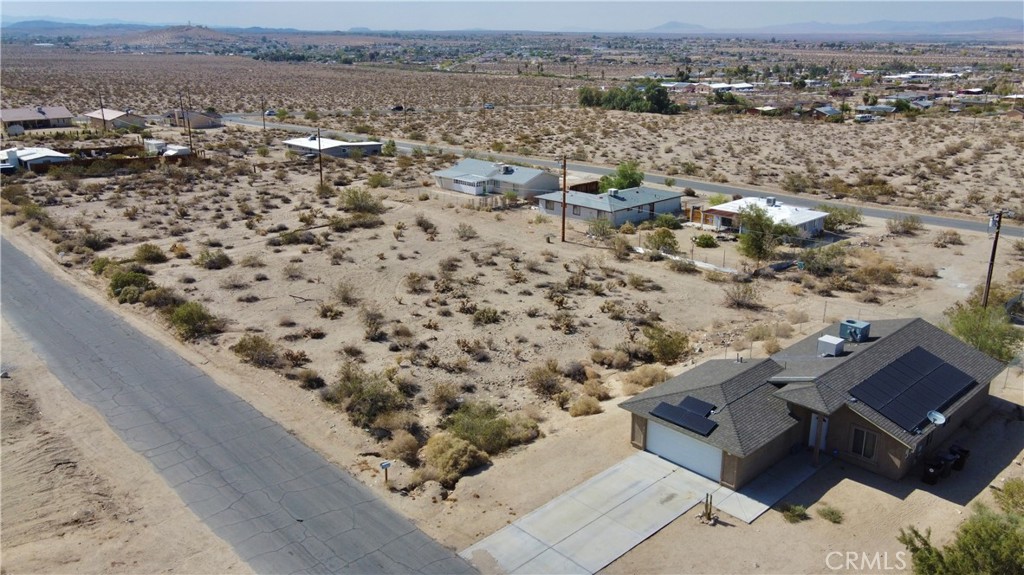 an aerial view of house with yard