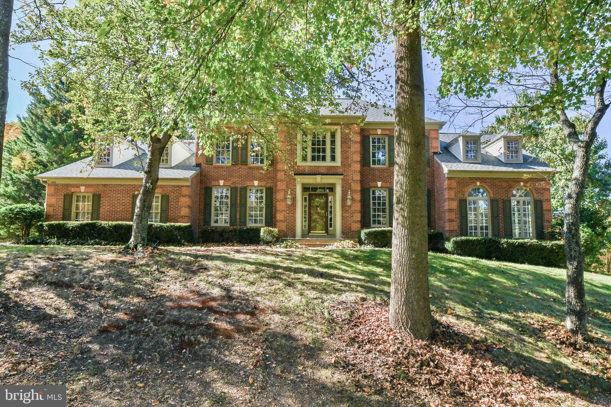 a view of a trees in front of a house