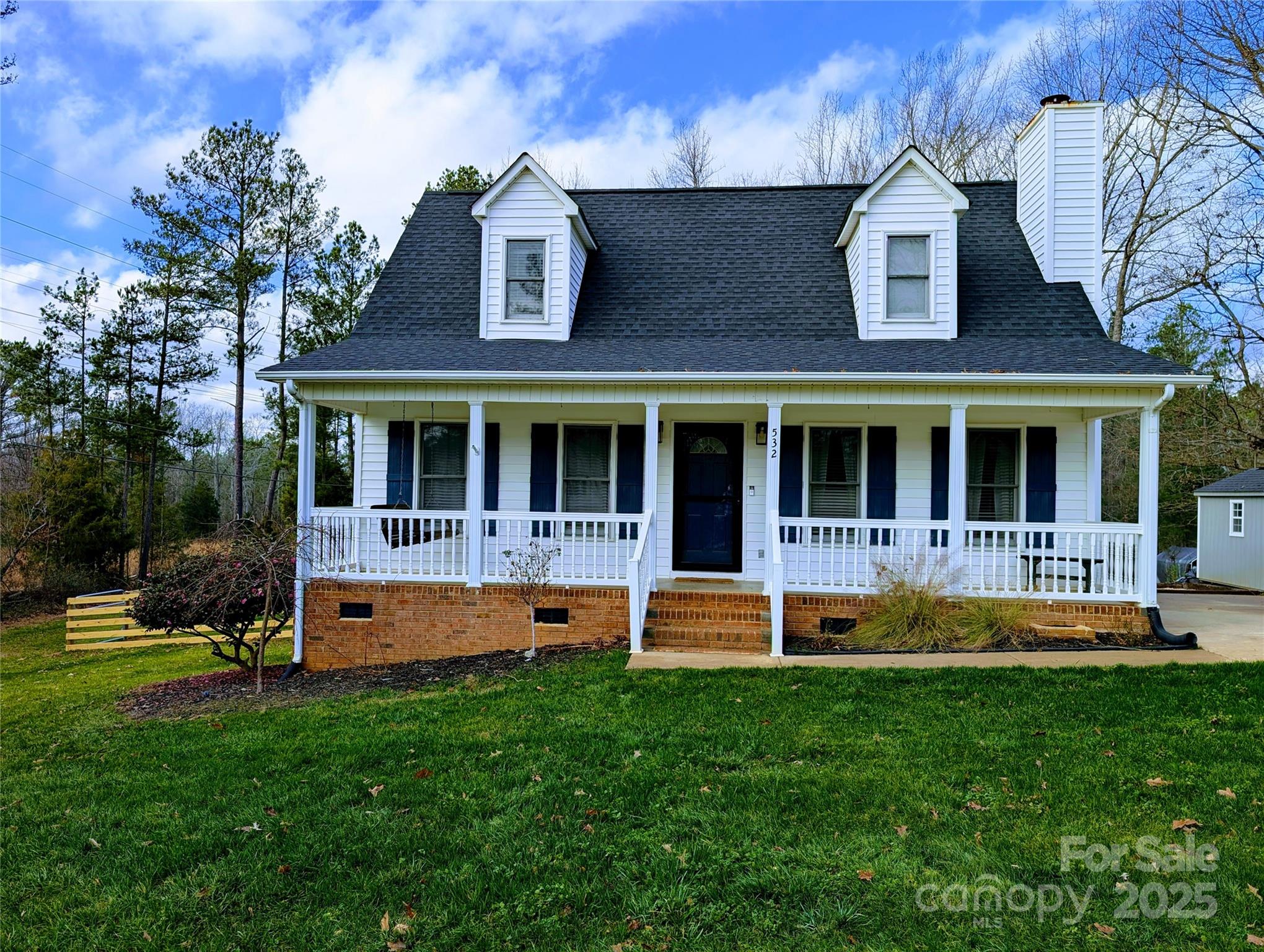 front view of a house with a yard