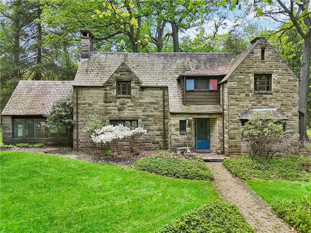 front view of a house with a yard