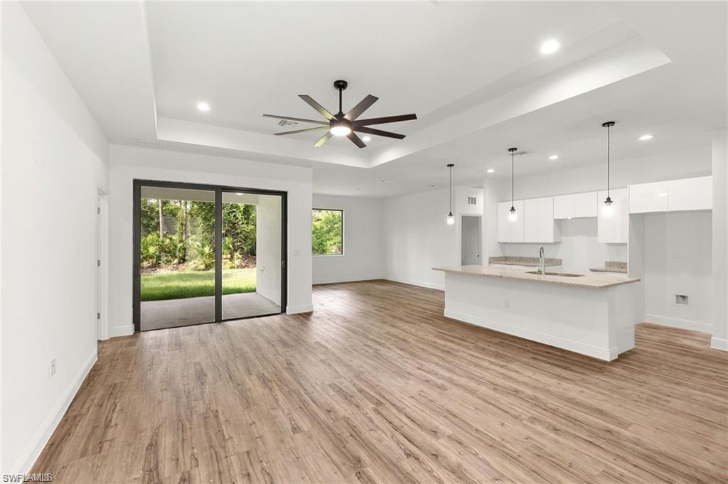 a view of kitchen with wooden floor and window