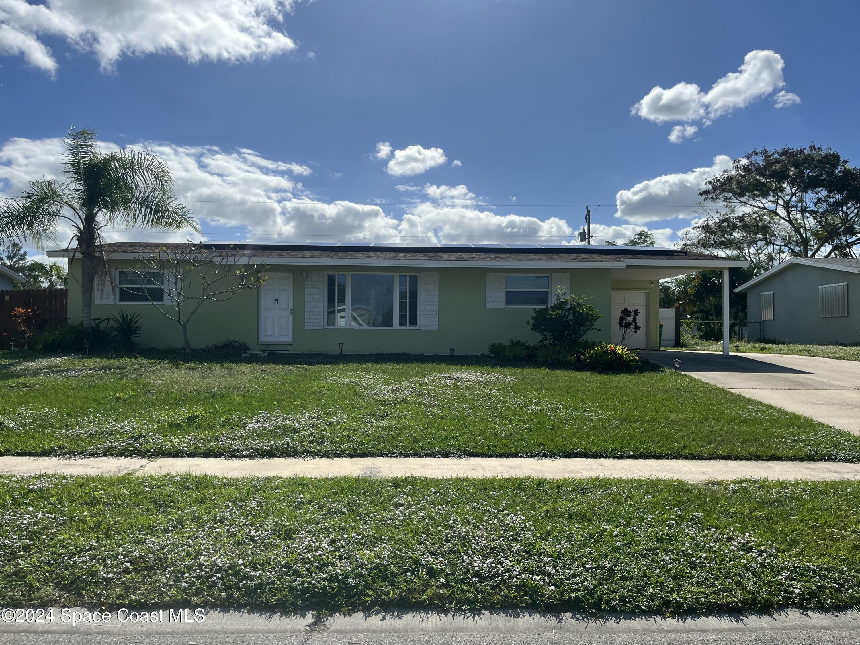 a view of a house with a garden