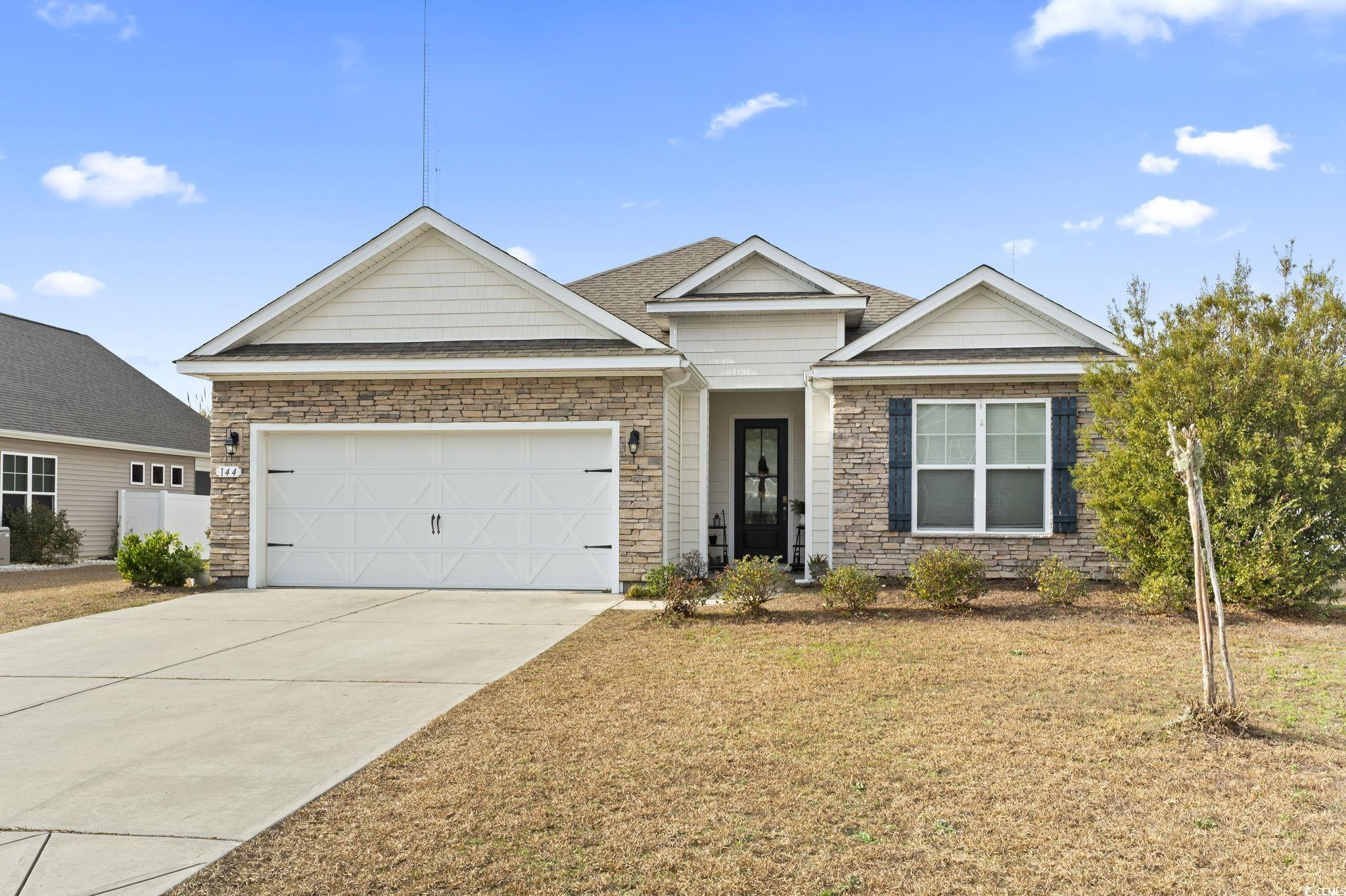 View of front of property with a garage