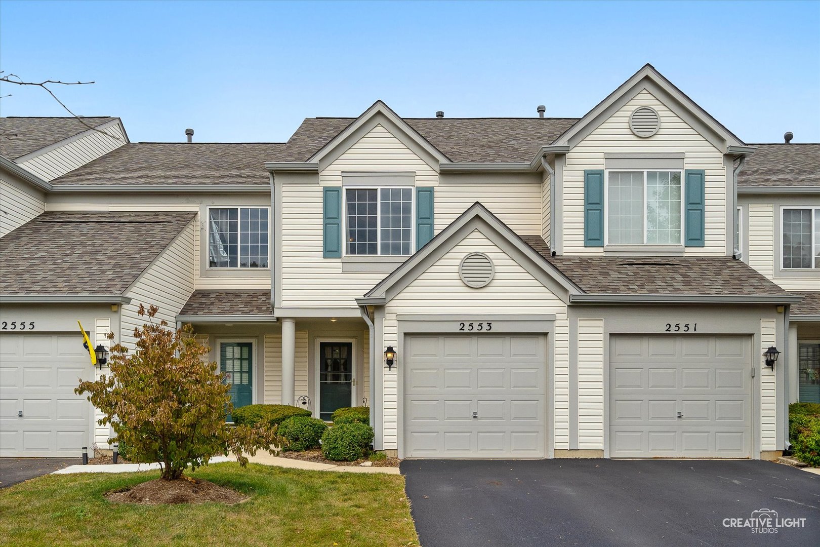 front view of a house with a yard