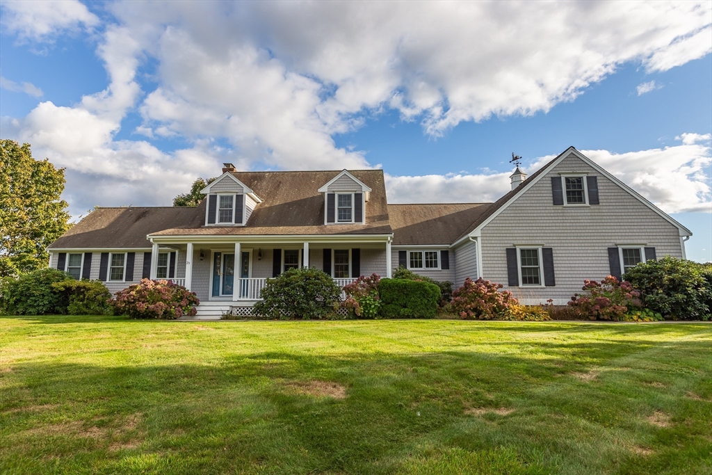 a front view of house with yard and green space