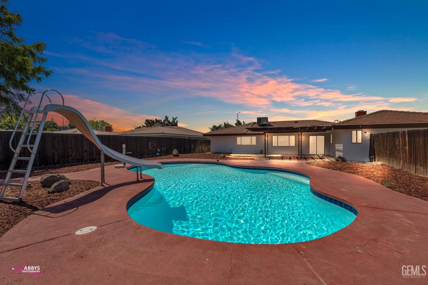 a view of a swimming pool with a patio