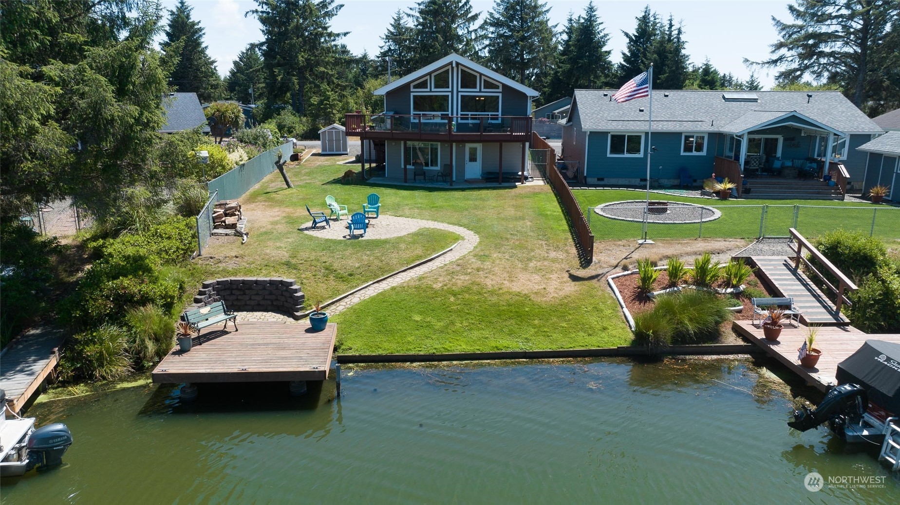 an aerial view of a house with swimming pool and porch