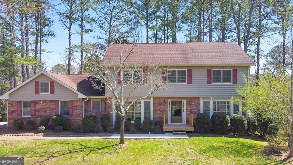 a front view of a house with a yard