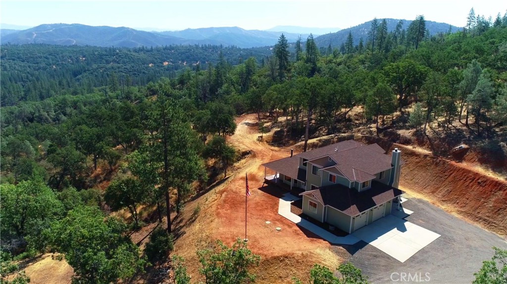 a view of a house with a mountain in the background