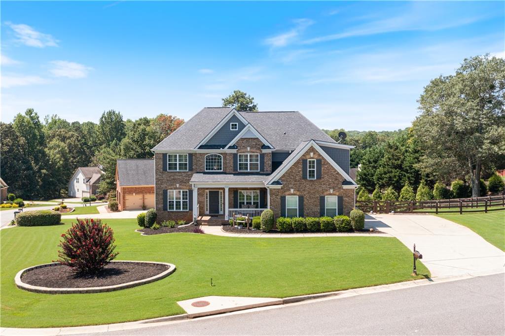 a front view of a house with a yard