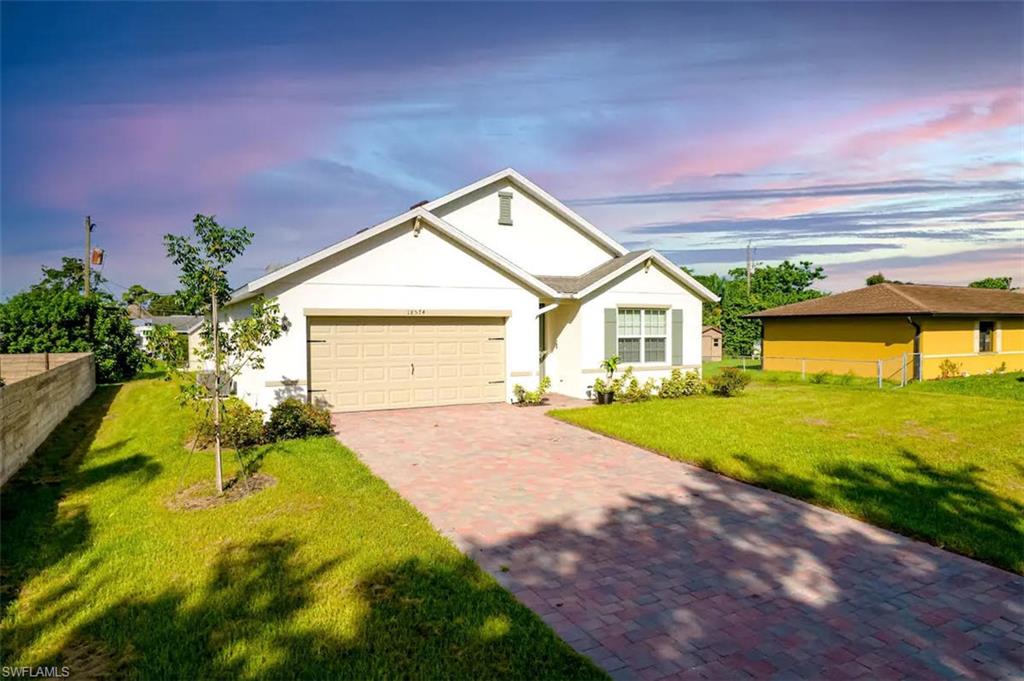 a house with garden in front of it