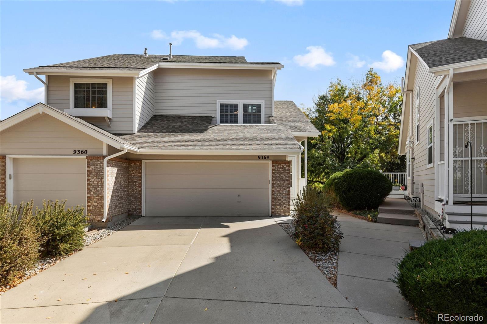 a front view of a house with garage