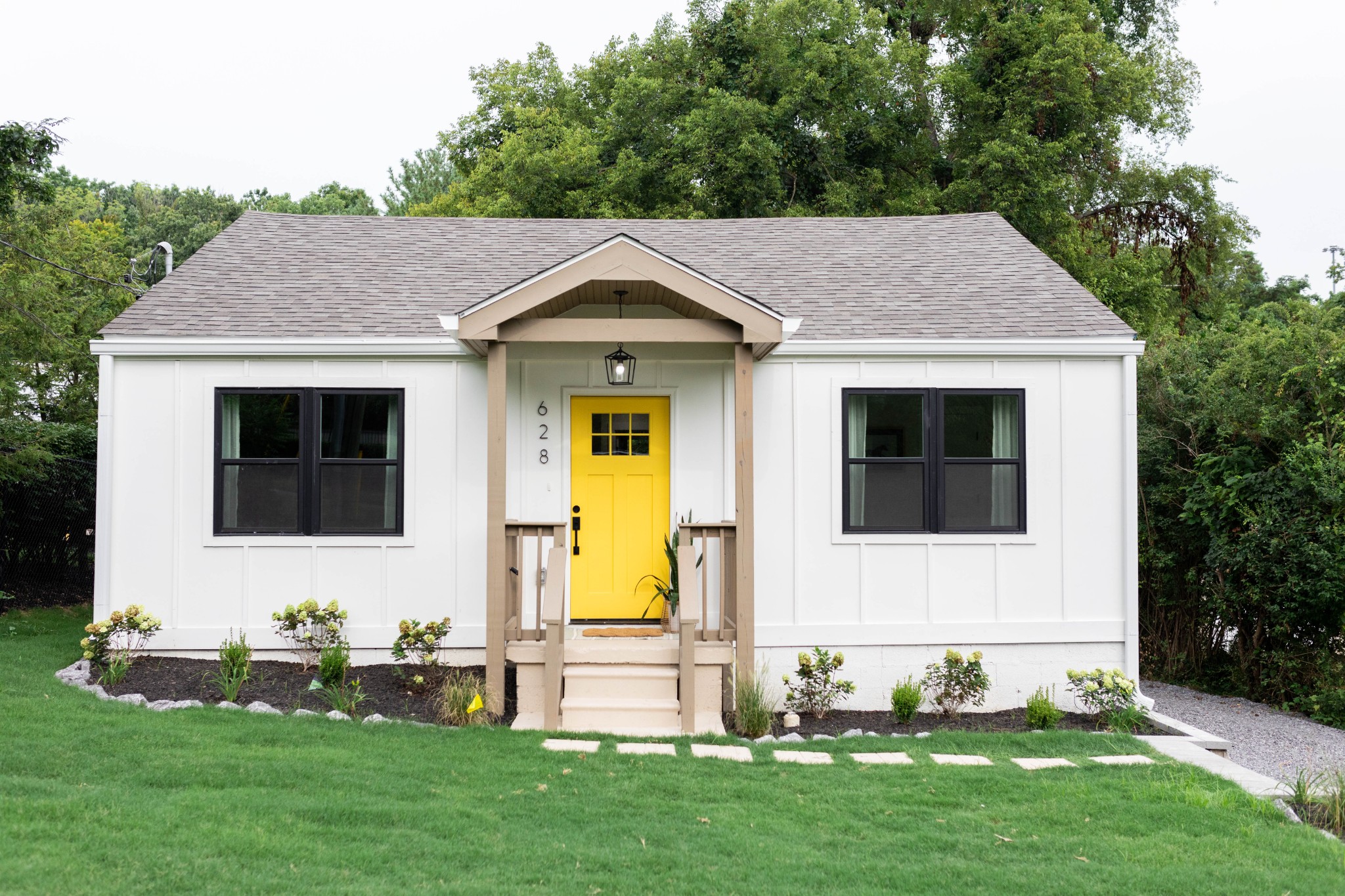 a front view of a house with garden