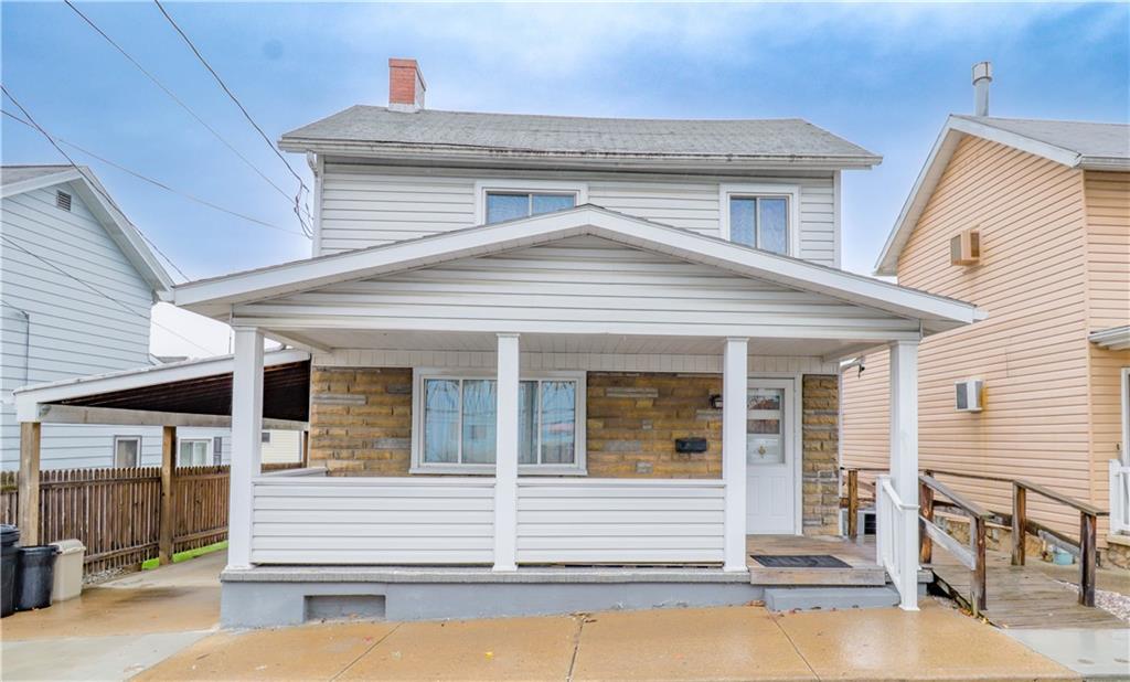 a front view of a house with a patio