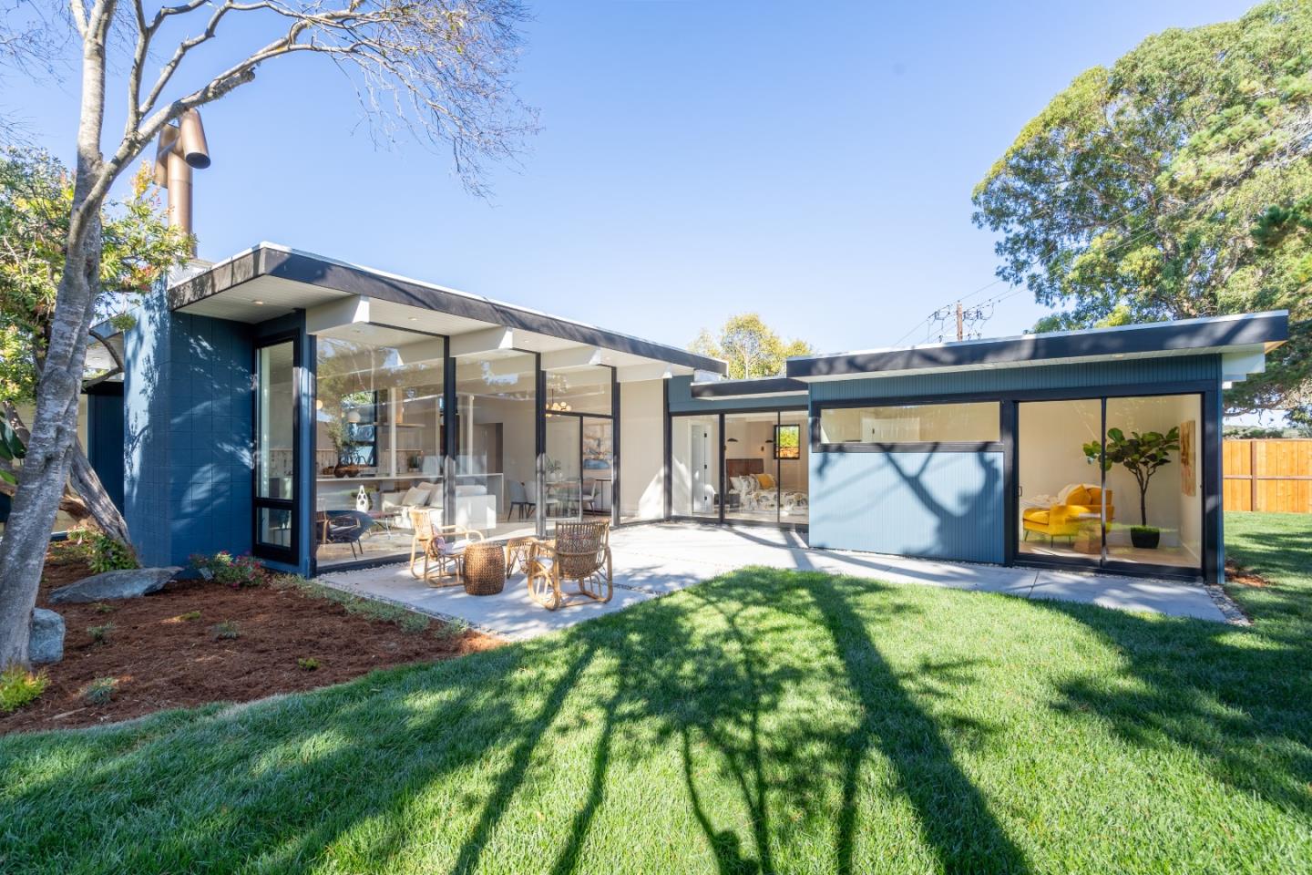 a view of swimming pool with outdoor seating and yard