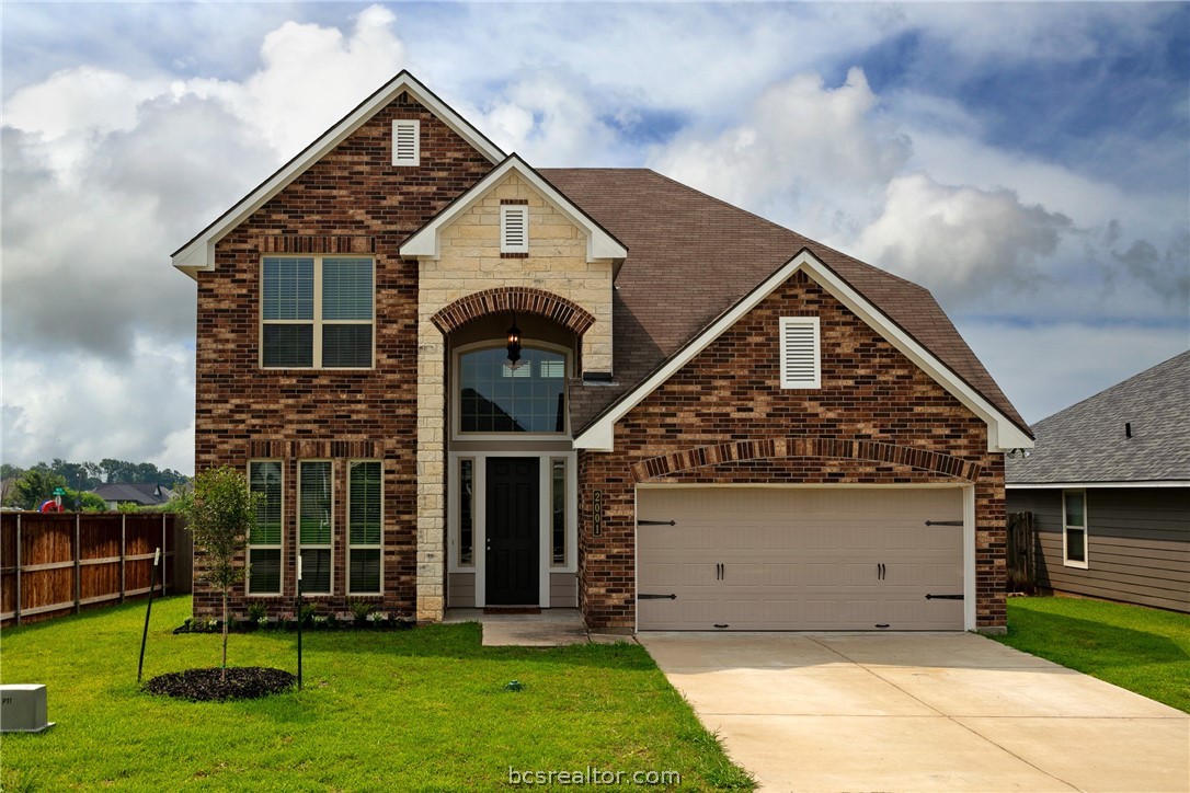 front view of a house with a yard