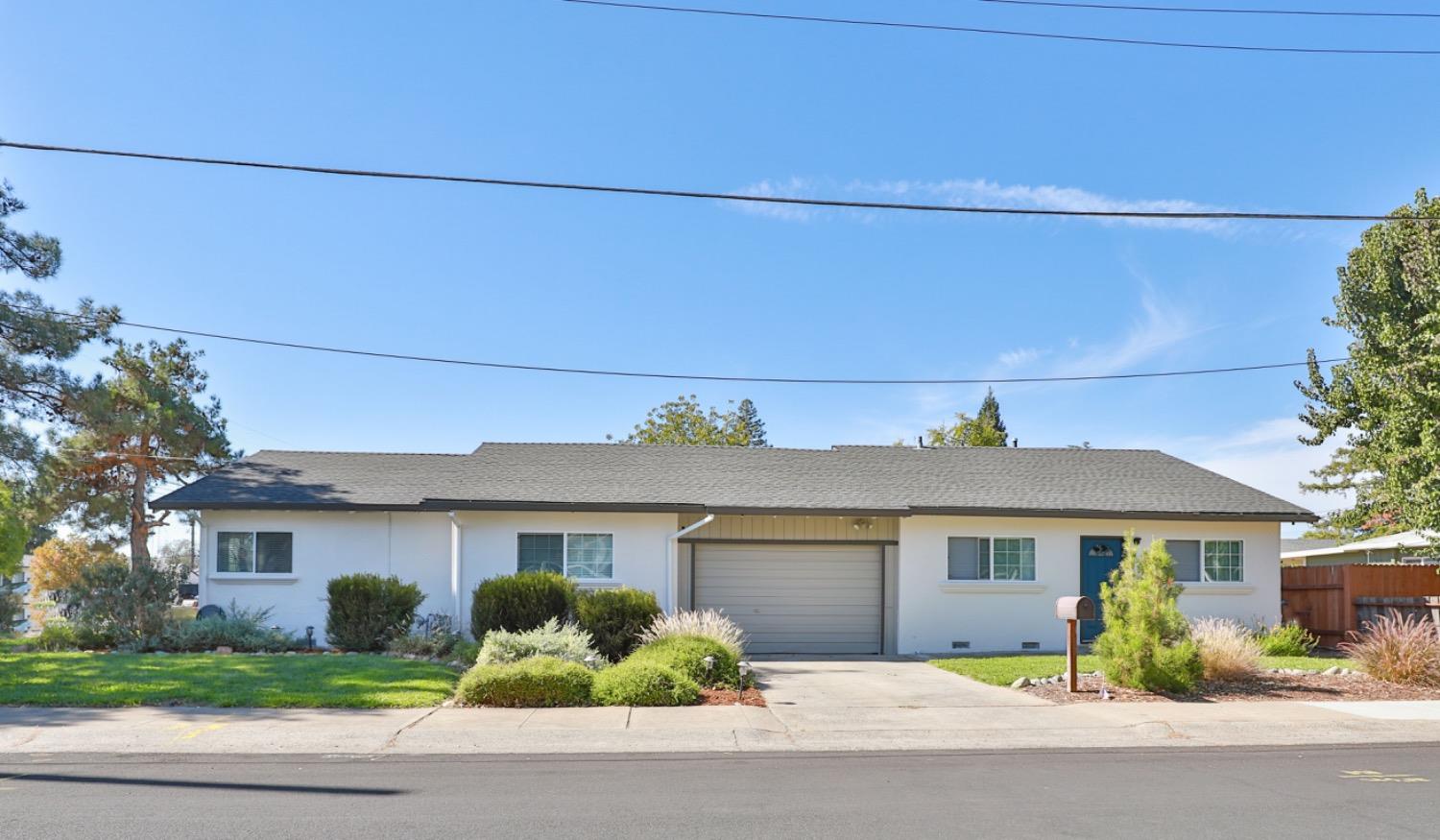 front view of a house with a small yard