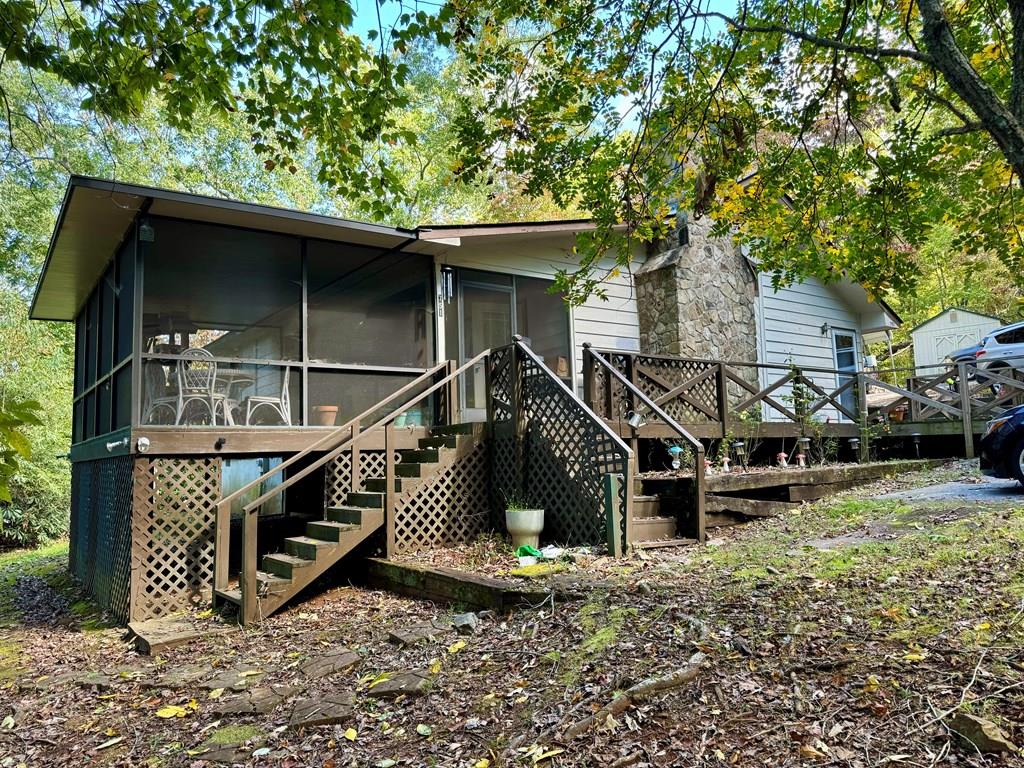 a view of a house with wooden fence