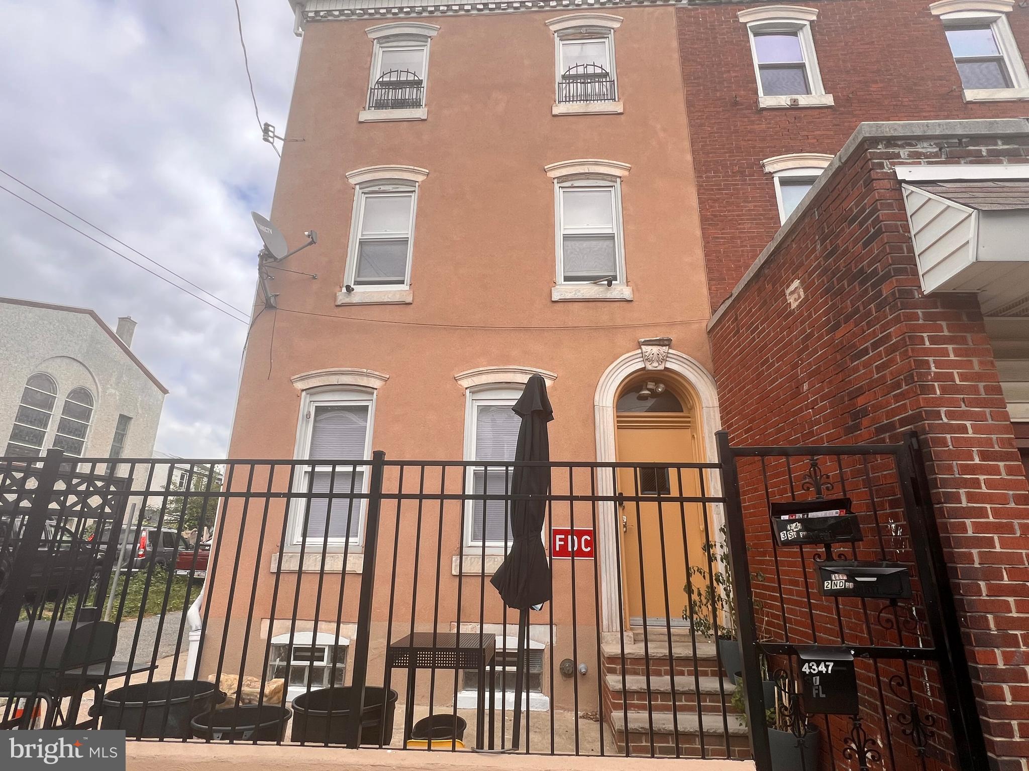 a front view of a brick house with many windows