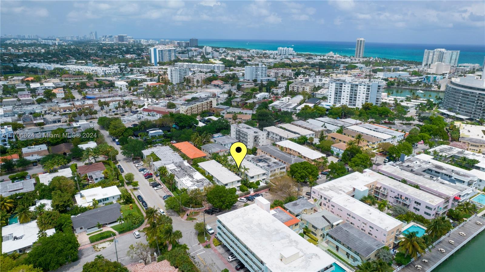 an aerial view of residential houses with city view