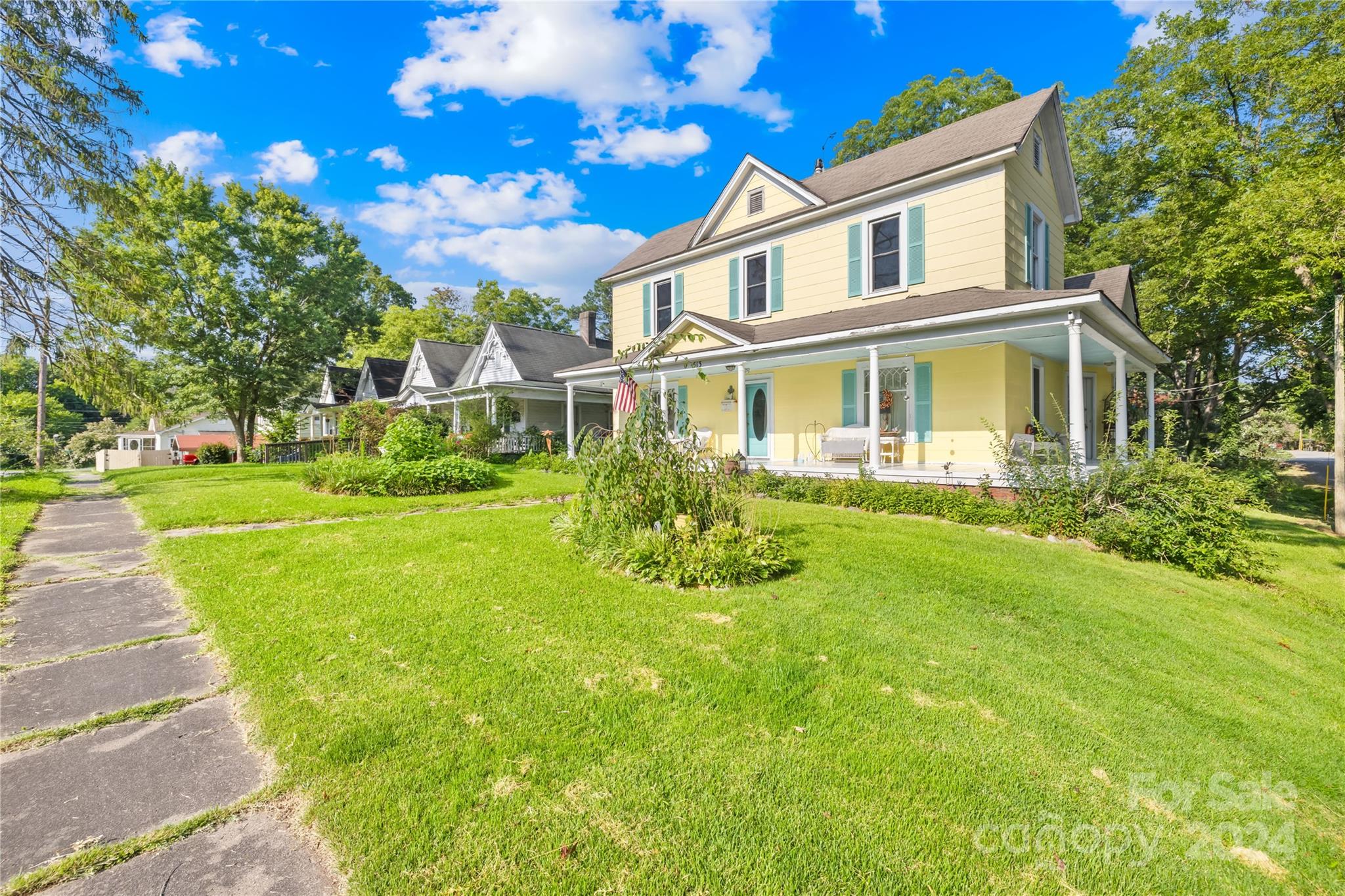 a front view of a house with garden