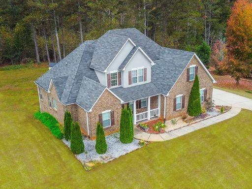 a front view of house with yard and green space