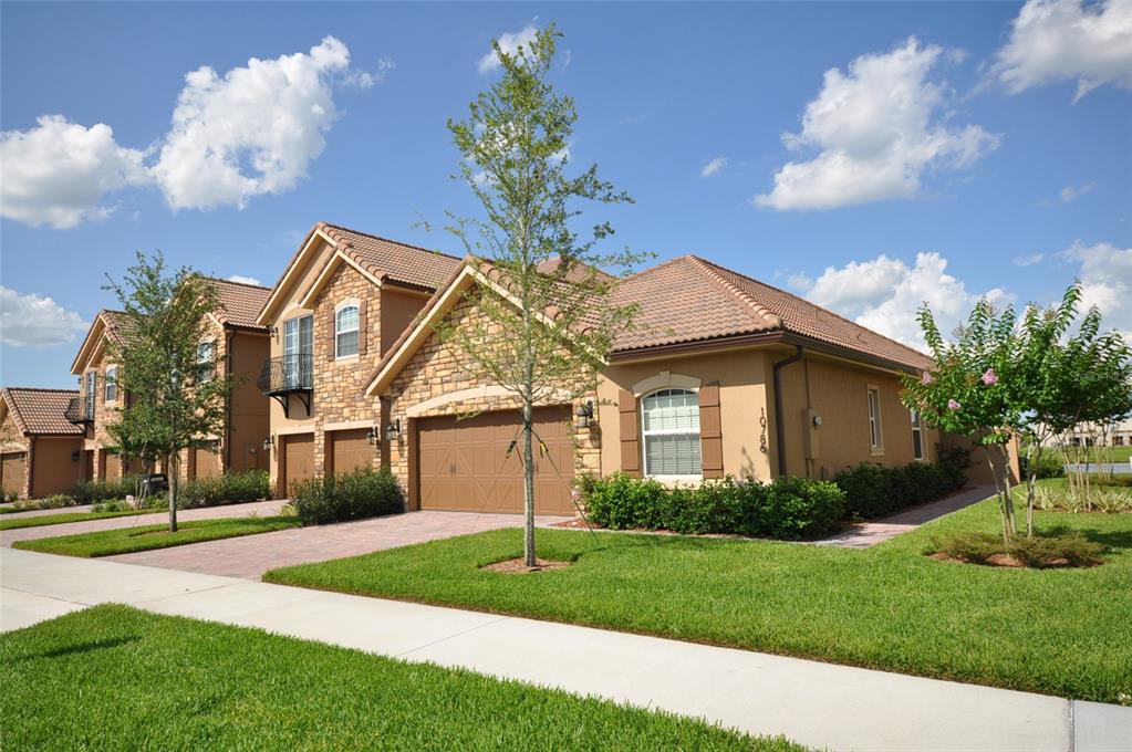 a front view of a house with garden