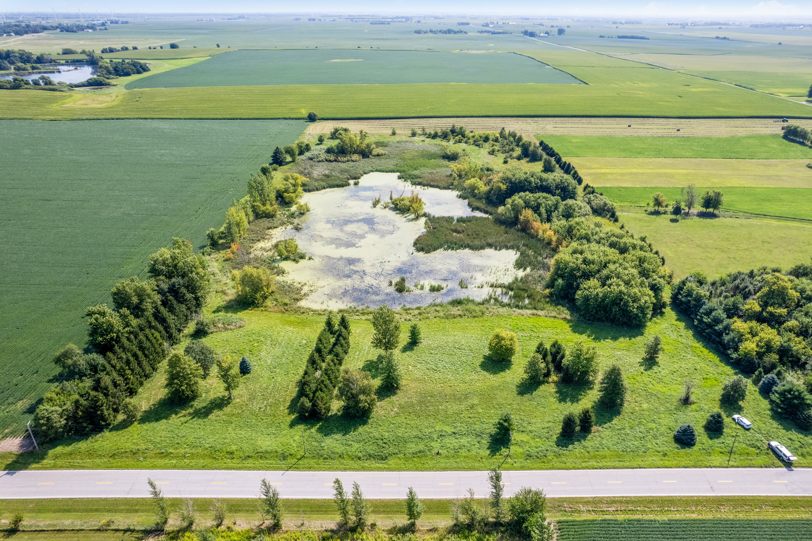 a view of a lake with a yard