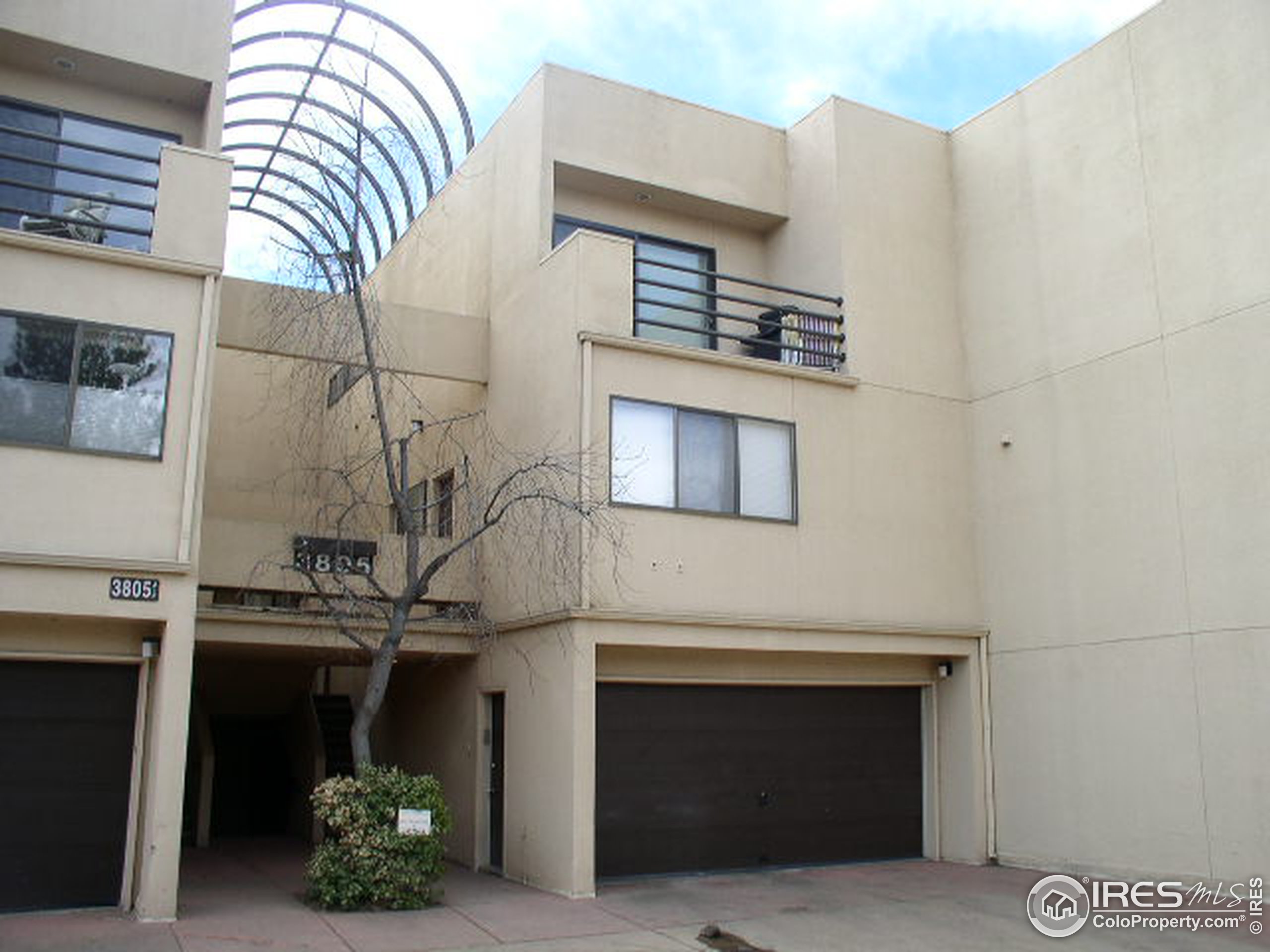 a front view of a house with lots of yellow lighting