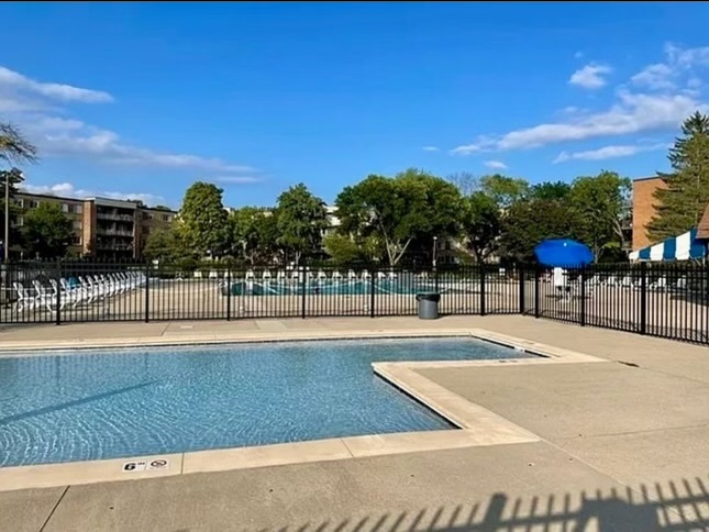 a view of a swimming pool with an outdoor seating