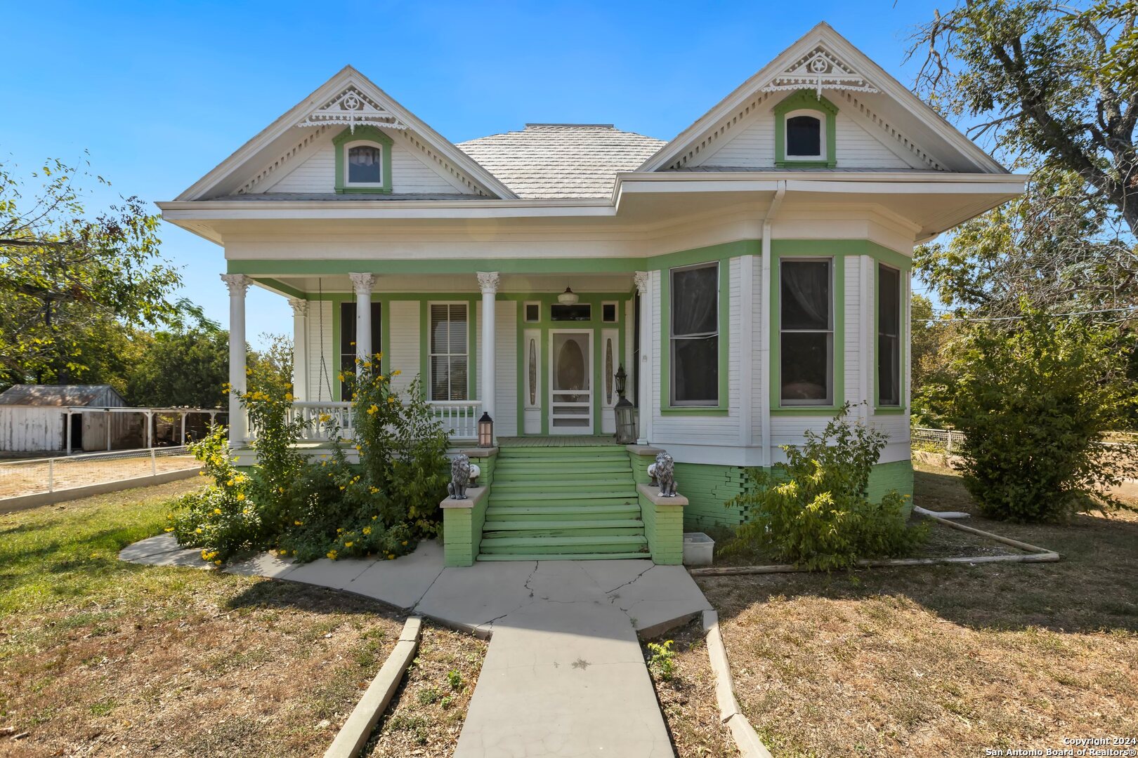 a front view of a house with garden