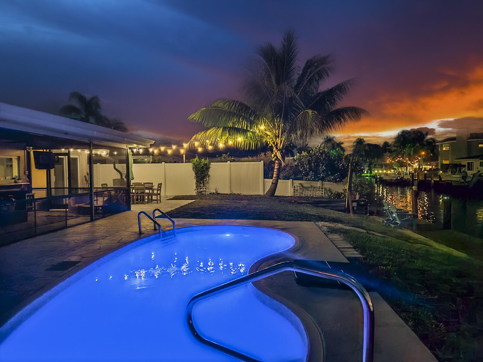 a view of a swimming pool with an outdoor space and seating area