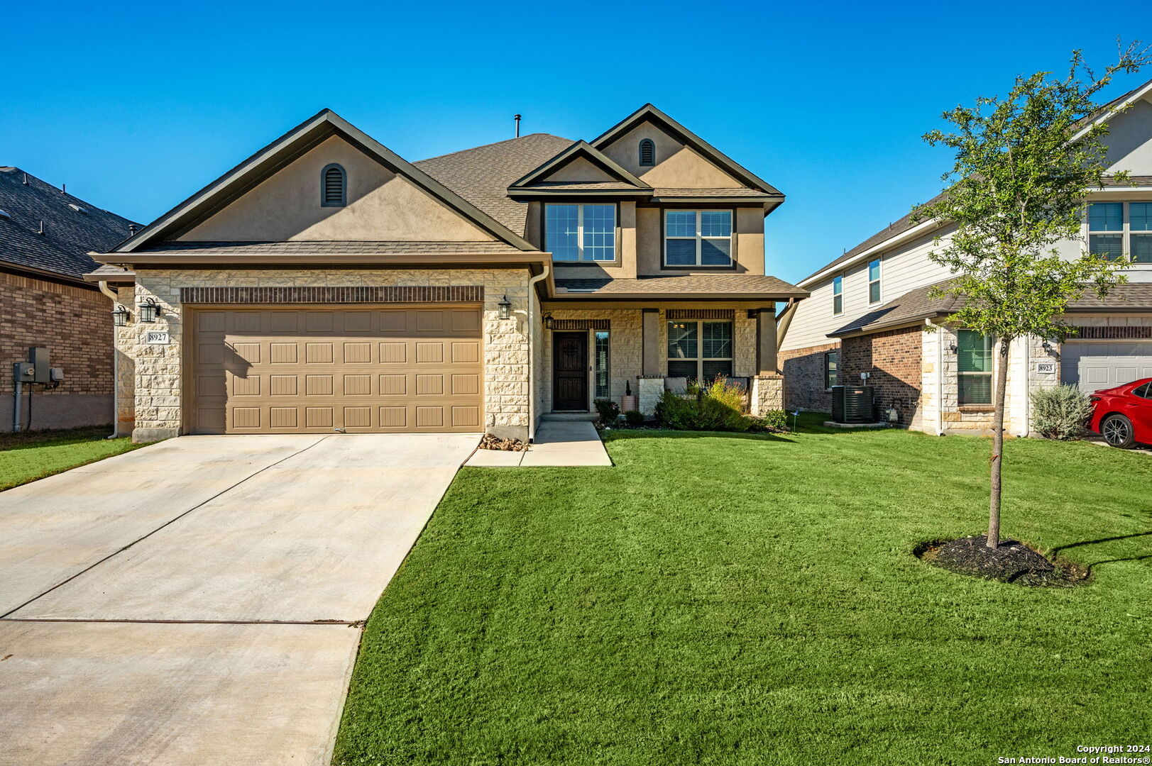 front view of a house with a yard