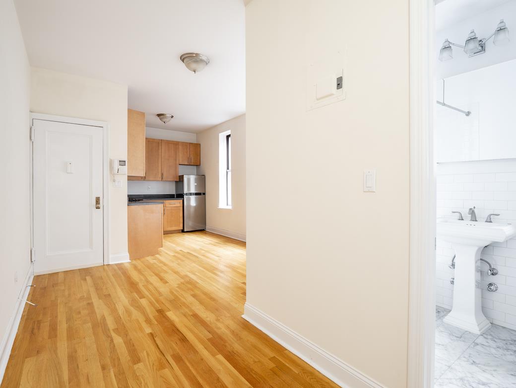 a spacious bathroom with a sink and a shower