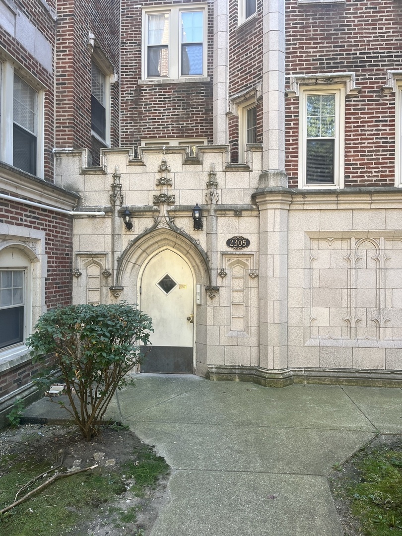 a view of a house with a sink and a yard