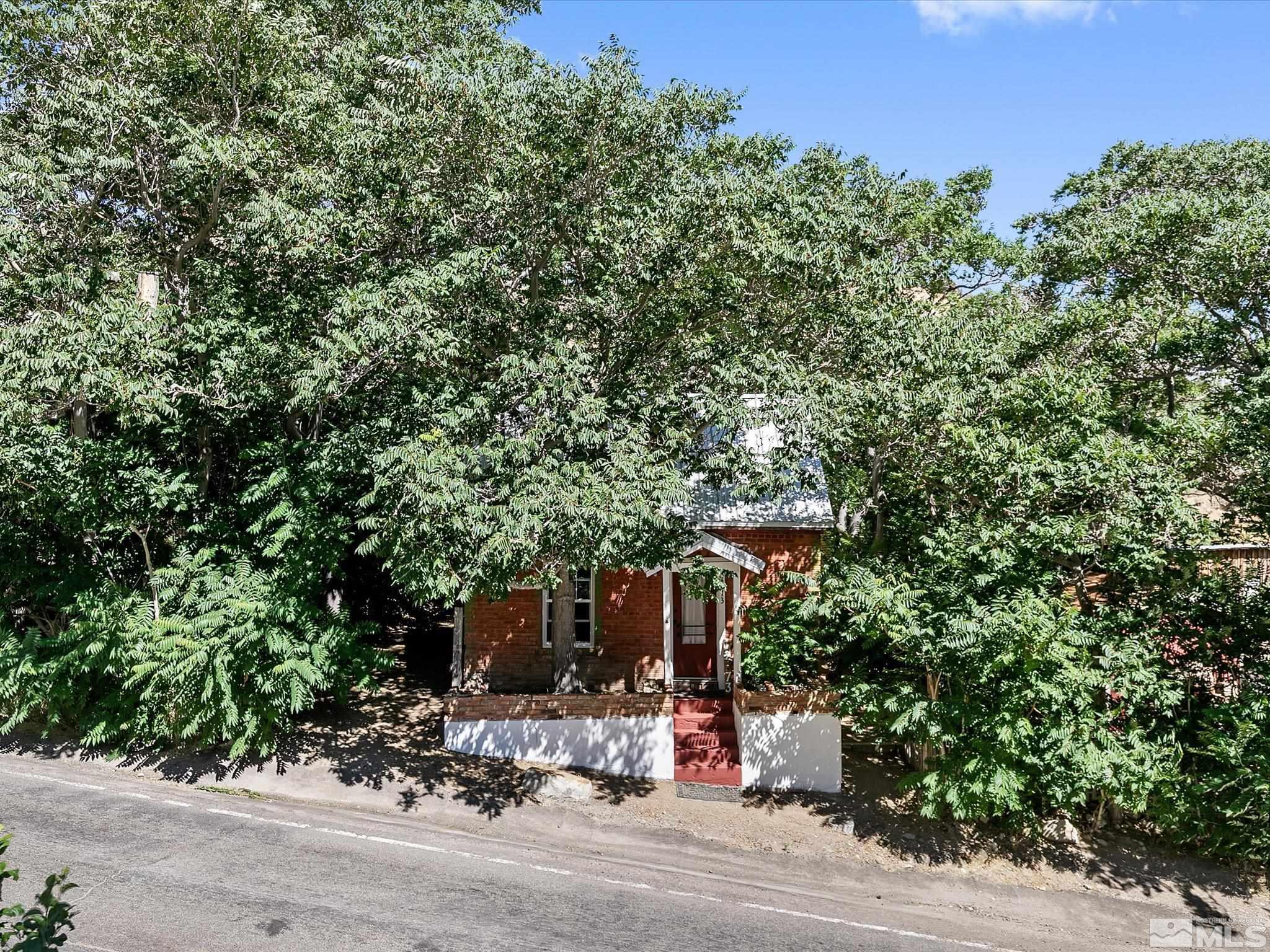 a view of a house with a tree park