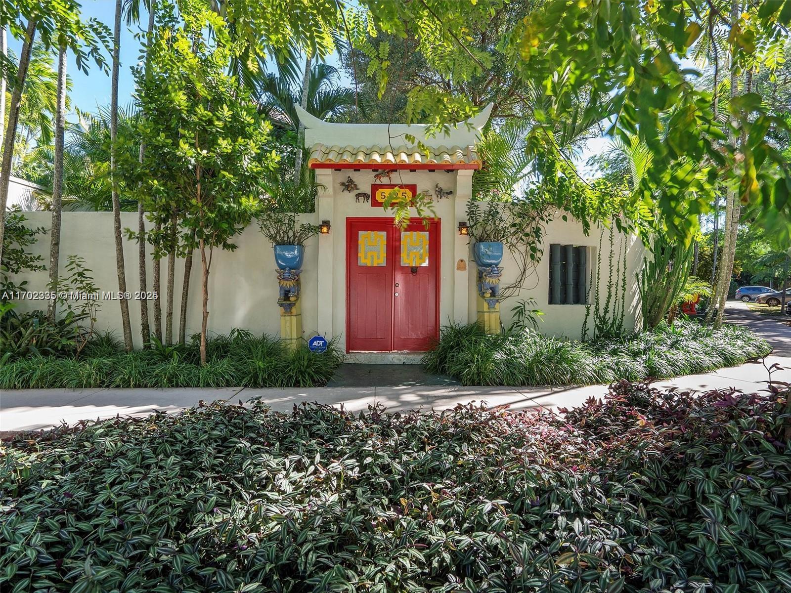 a front view of a house with garden