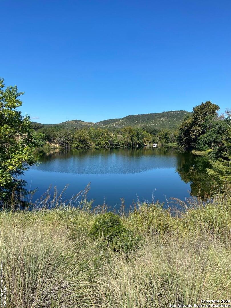 a view of a lake with mountain in the background