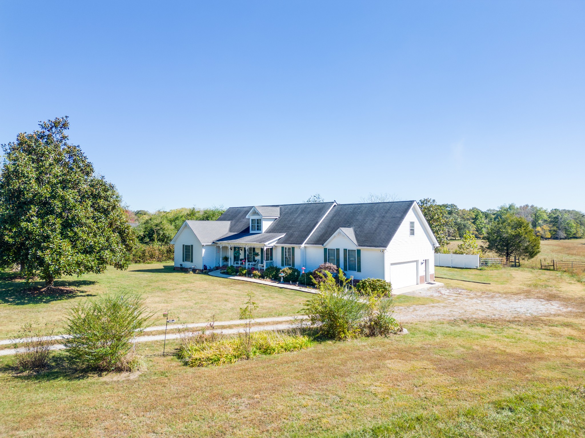 a view of a house with a big yard