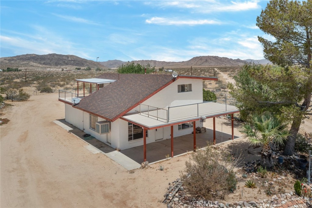 a view of a house with a mountain