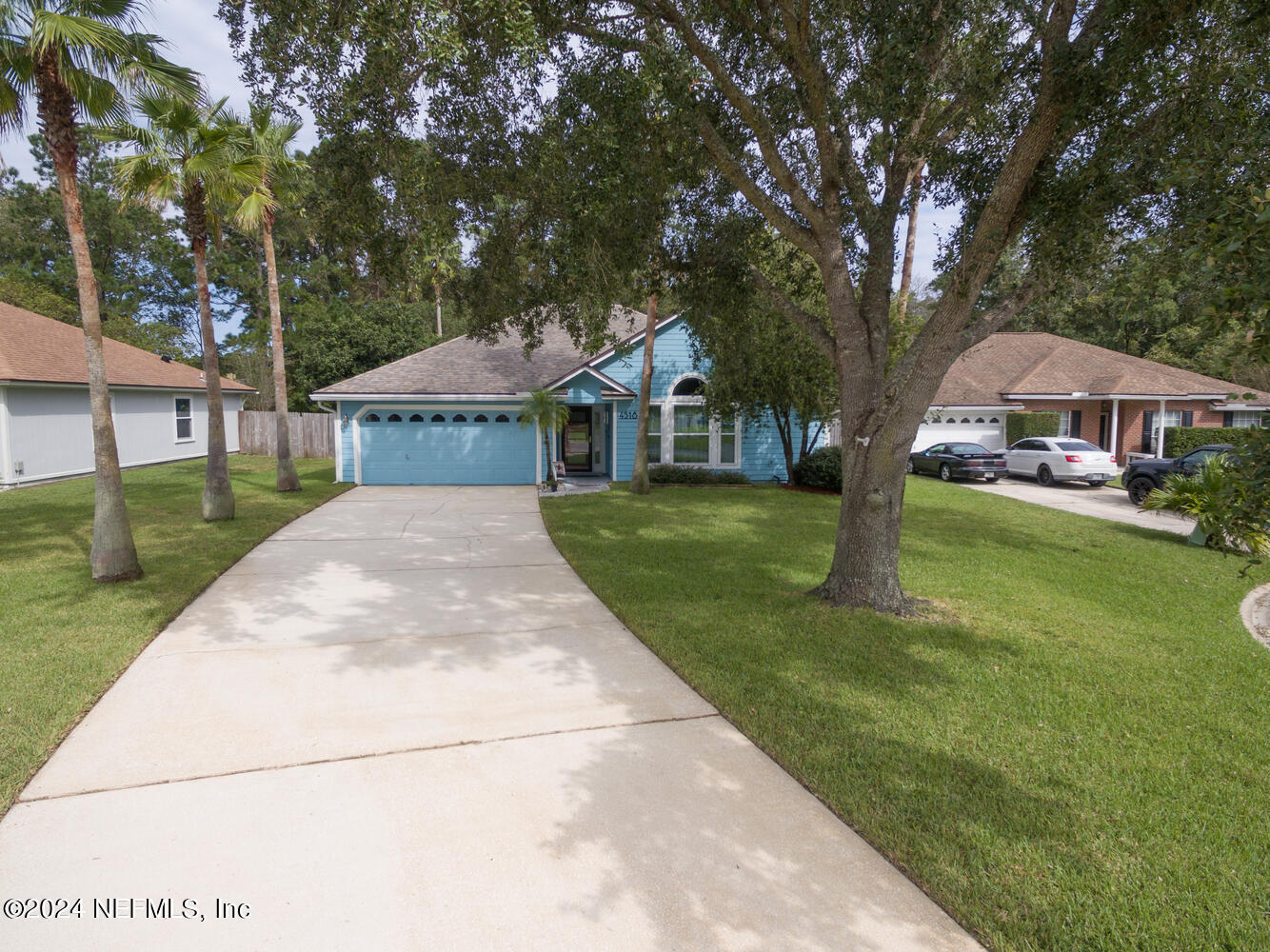 a front view of a house with yard porch and green space