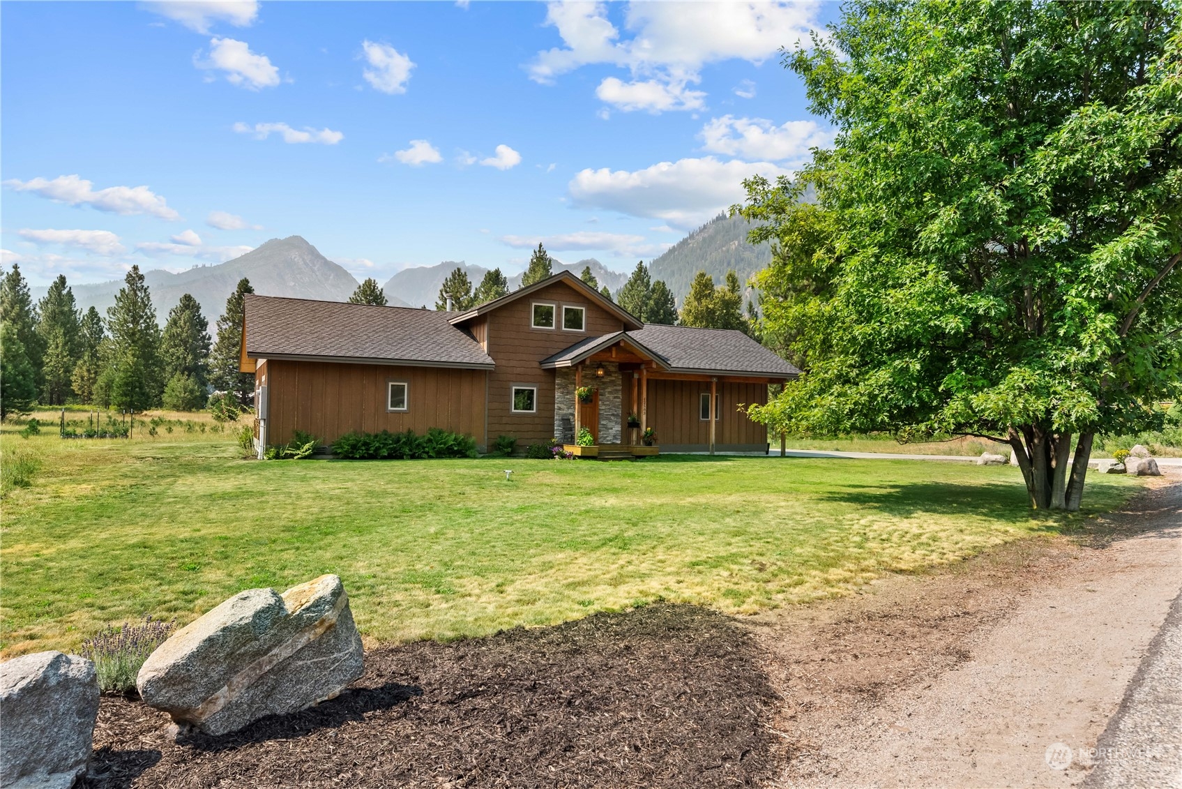 a front view of a house with a garden