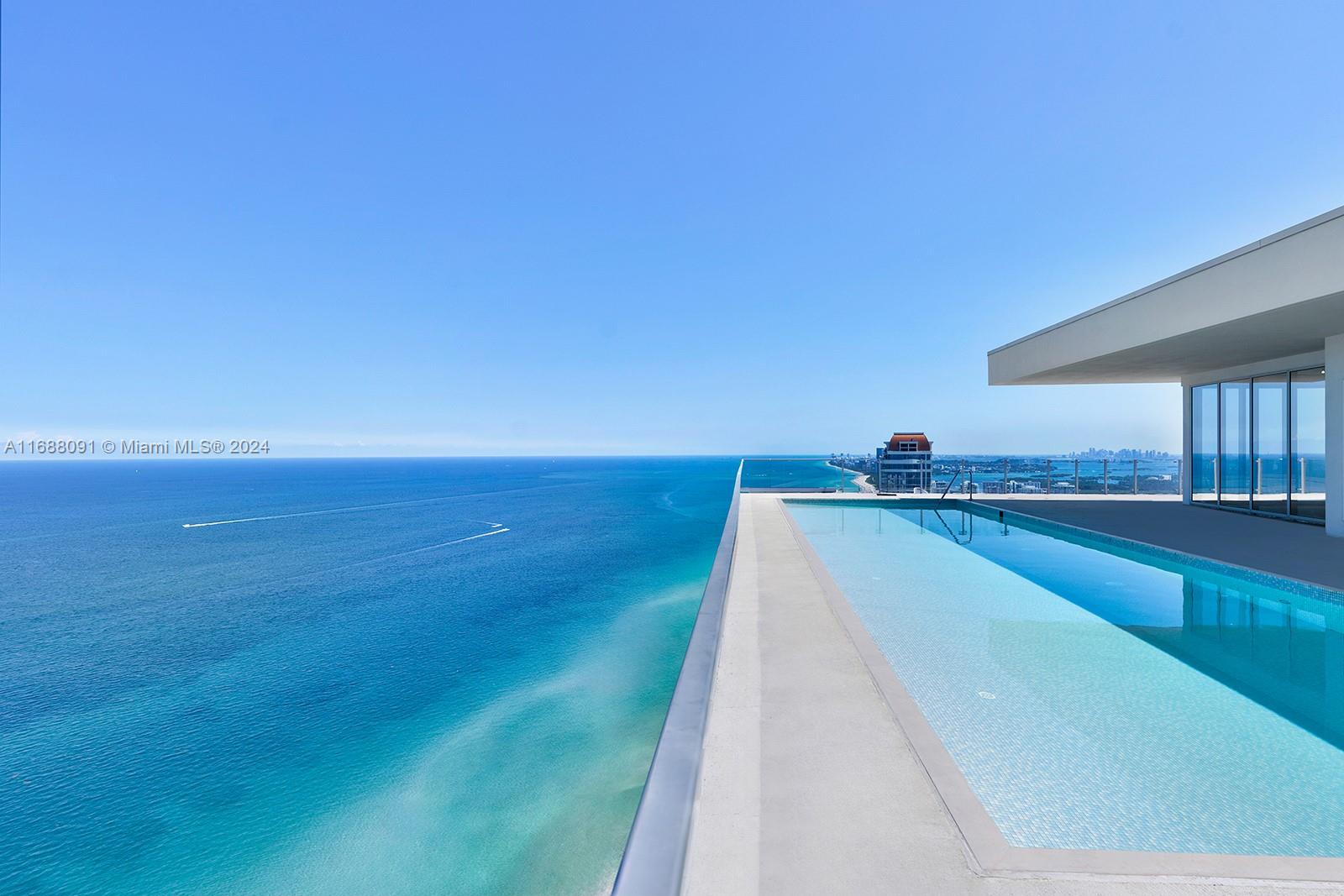 a view of a swimming pool and an outdoor space