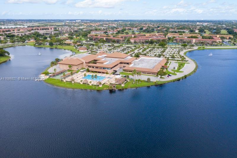 an aerial view of a house with a swimming pool