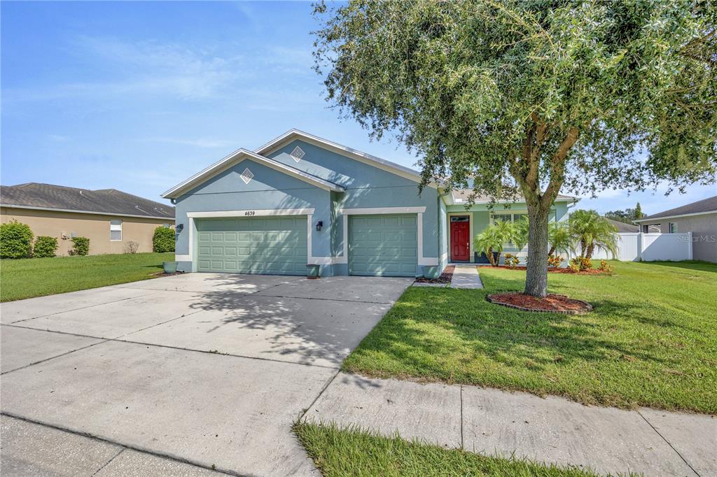 front view of a house with a yard