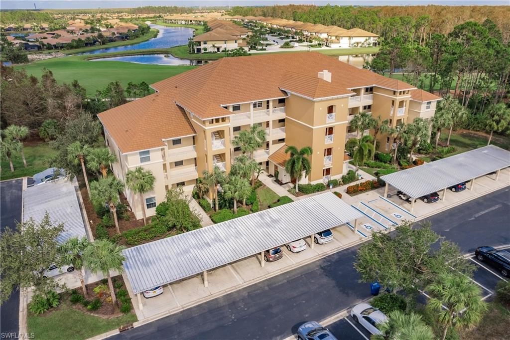 an aerial view of residential houses with outdoor space and street view